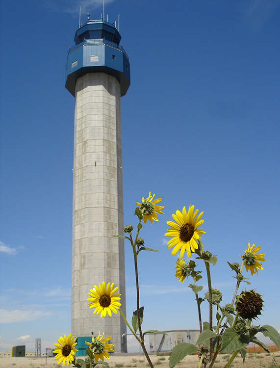 Colorado Air and Space Port air traffic control tower with sunflowers