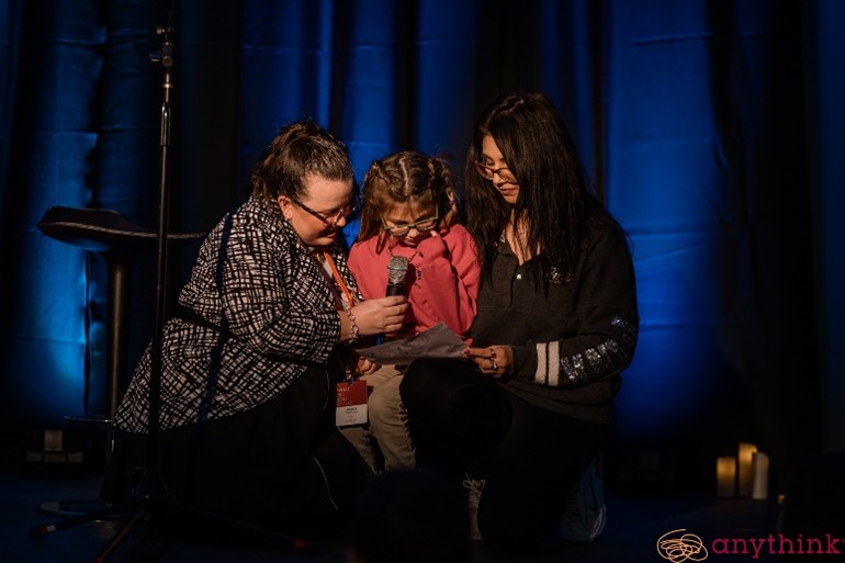 A young poet performs an original work at an Unstudied event.