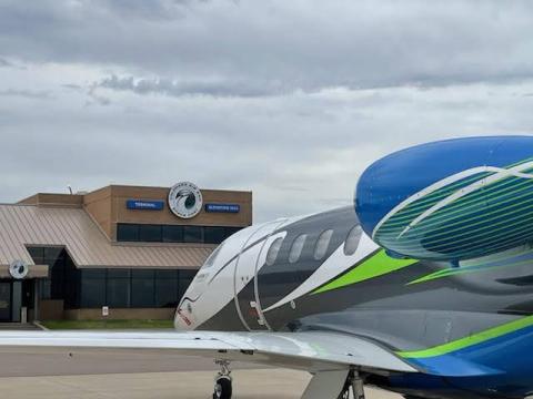 Airplane with the Colorado Air and Space Port terminal in background