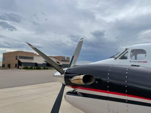 Airplane parked in front of Colorado Air and Space Port